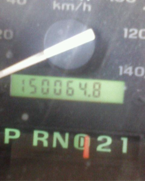 1995 Ford Bronco - The odometer shows over 150,000 miles, and the gear selector is in reverse.