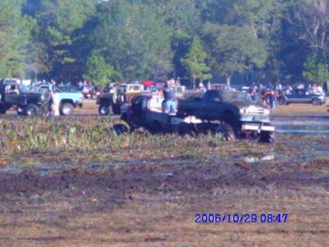 1987 Suzuki Samurai - Mud bog event with multiple trucks stuck in the mud. Date stamp 2006/10/29.