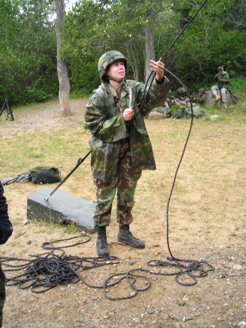 2003 Jeep TJ - Military personnel practice with ropes in an outdoor training environment.