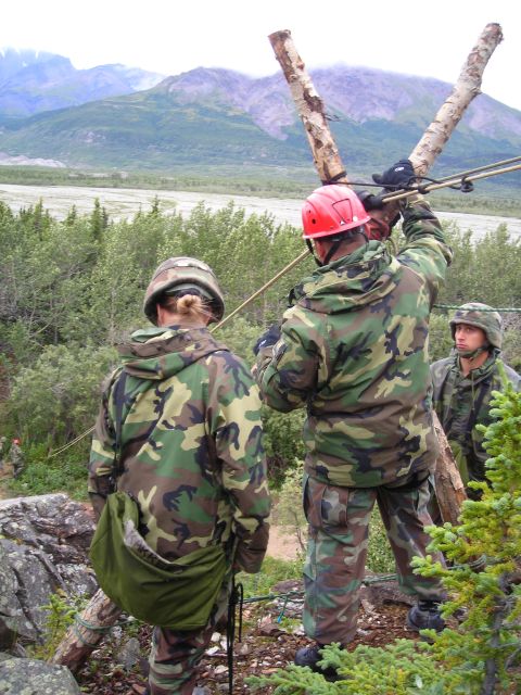 2003 Jeep TJ - Military personnel train with ropes and gear in a , mountainous terrain.