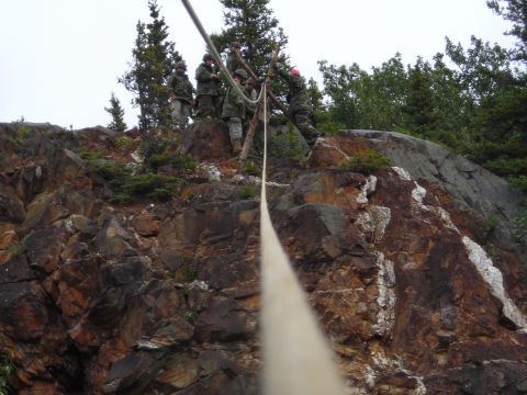 2003 Jeep TJ - Soldiers descend a steep, rocky incline using ropes and harnesses during a training exercise.