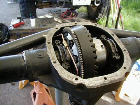 1995 Ford Bronco - Close-up of an open differential housing, revealing the internal gears and assembly.