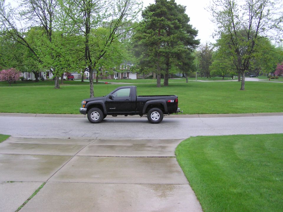 Black pickup truck, side view. Appears to be a 2004 model