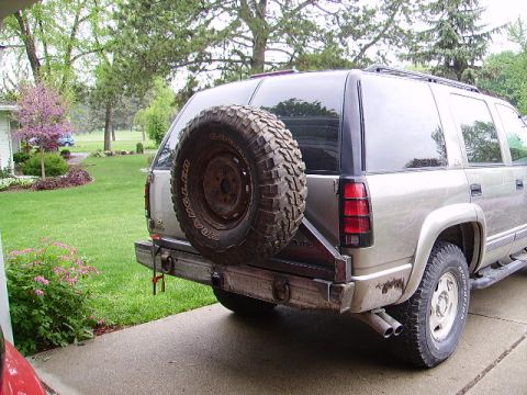 2000 Chevrolet Tahoe - The rear of a 2000 Chevrolet Tahoe features a custom bumper with a mounted spare tire.
