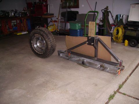 2000 Chevrolet Tahoe - Custom rear bumper assembly and spare tire shown on a garage floor.