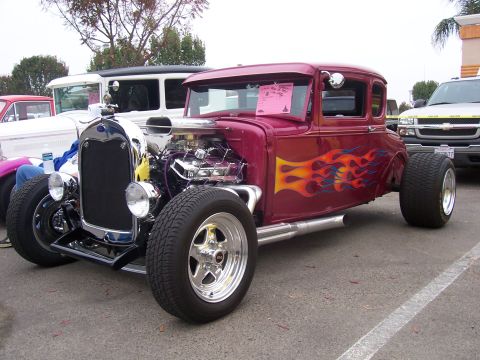 2002 Ford Mustang - A custom hot rod coupe is parked outdoors, with other vehicles in the background.