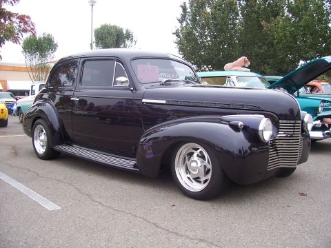 2002 Ford Mustang - Custom hot rod coupe with a distinctive grille and lowered stance, parked outdoors.