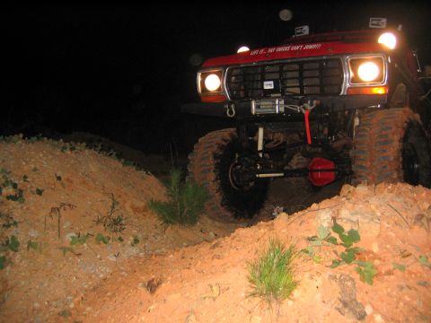 1979 Ford Bronco - This modified 1979 Ford Bronco navigates a challenging dirt incline in the dark.