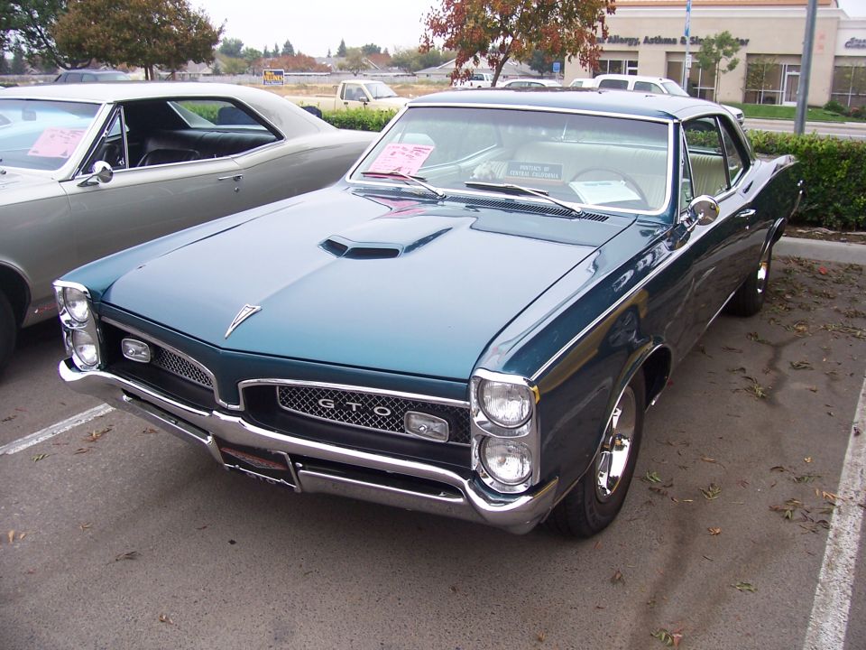 Teal 1967 Pontiac GTO front view with GTO badge on grille