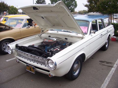 2002 Ford Mustang - A white station wagon with a blue roof is parked with its hood open, revealing the engine bay.