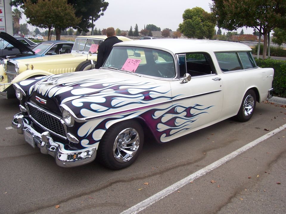 White 1955 station wagon with purple and white flames, 3q-front view