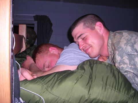 2003 Jeep TJ - Two soldiers rest in a dormitory setting, one appearing to sleep on the other's shoulder.