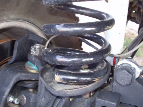 1993 Ford Bronco - Focus on the suspension components, showing the coil spring and surrounding hardware.