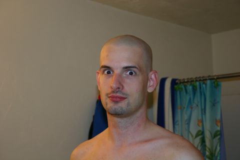 1995 Ford Probe - A man with a freshly shaved head and a surprised expression stands in front of a patterned shower curtain.