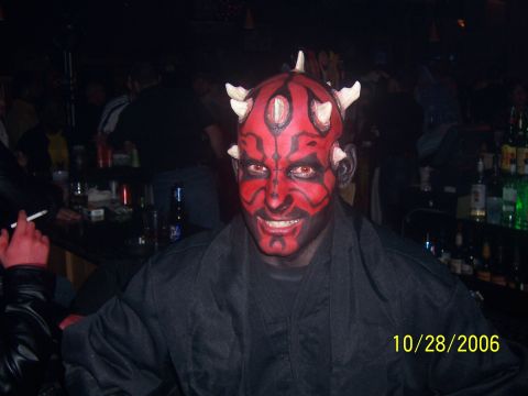 1995 Ford Probe - A person in a Darth Maul costume smiles at the camera in a dimly lit bar.