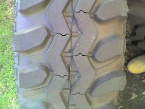 1989 Ford Bronco - Aggressive tread pattern on an off-road tire is visible.