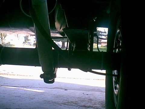 1983 Ford Bronco - sorry for the dar picture but there is no more factory shim block. this will reduce axle wrap-up.