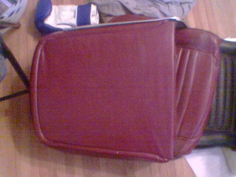 1969 Ford F-250 - A red vinyl seat cushion is shown, possibly for a vintage vehicle. The registry claims it is a 1969 Ford F-250, but this is unconfirmed.