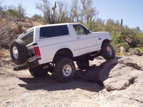 1993 Ford Bronco - This 1992 Ford Bronco is navigating a rocky off-road course in a desert environment.