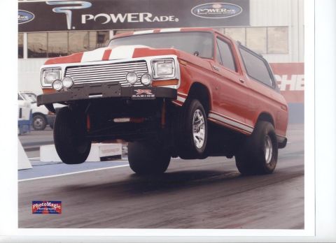 1979 Ford Bronco - This modified Ford Bronco is performing a wheelie on a drag strip.