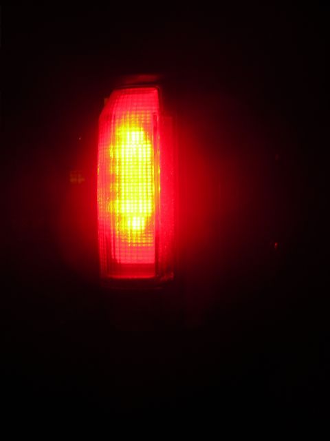 1995 Ford Bronco - A single vehicle tail light is illuminated, showing its internal LED pattern.