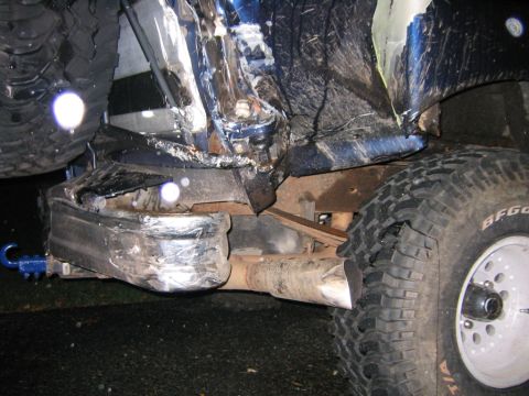 1994 Ford Bronco - The rear of a 1994 Ford Bronco shows significant damage to the bumper and a BFGoodrich tire.