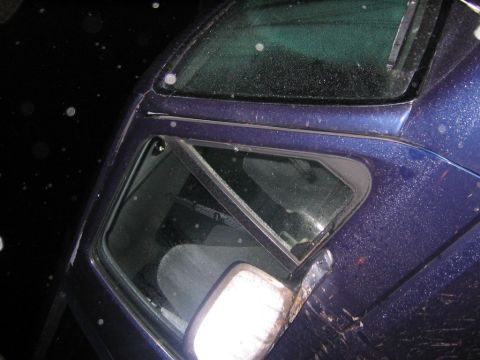 1994 Ford Bronco - A blue SUV, possibly from the early 1990s, is shown with damage to its side.