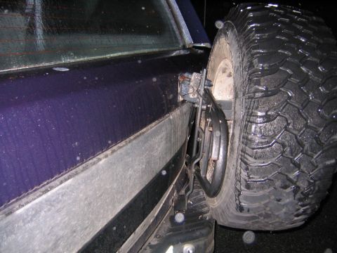 1994 Ford Bronco - The rear of a 1994 Ford Bronco shows its spare tire mount and purple paint.
