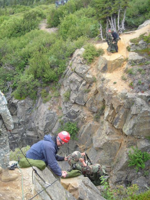 2003 Jeep TJ - Rescue operation in progress as soldiers navigate a challenging rocky terrain.