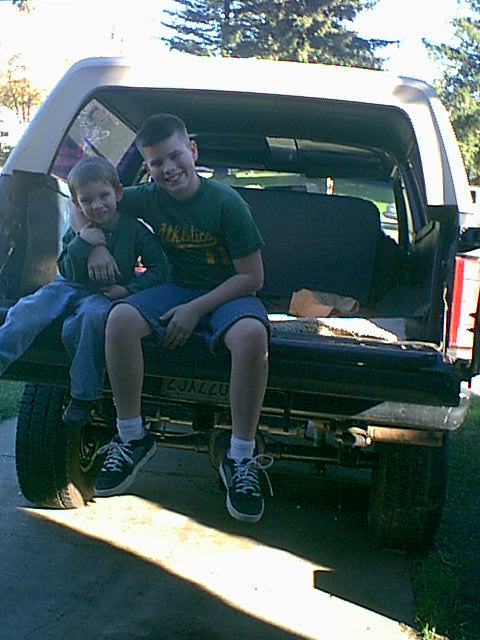 1983 Ford Bronco - here is Christian and Josh sitting on the tailgate after some repair.