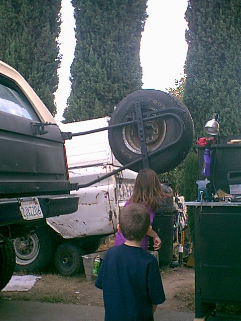 1983 Ford Bronco - here is Monica and Christian doing the "Limbo" under the spare tire.