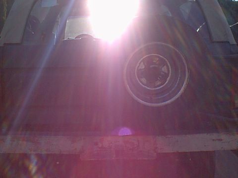 1983 Ford Bronco - here is a bad shot of the old spare and rim