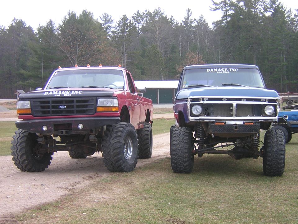 Blue 1970s Ford pickup truck with lifted suspension and large tires