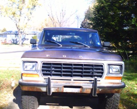 1979 Ford Bronco - Front view of a brown 1978 Ford Bronco with a rusty bumper and detailed grille.