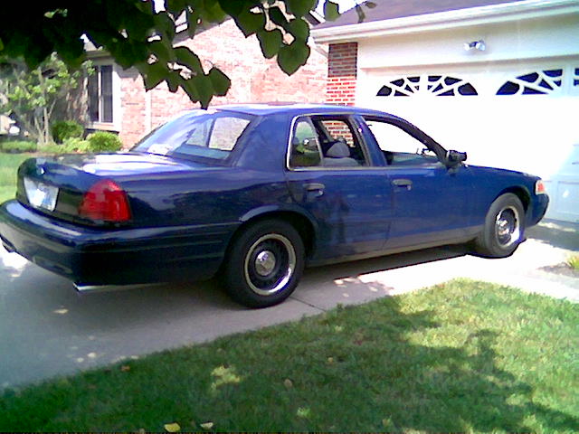 Blue 2001 Ford Crown Victoria parked in driveway