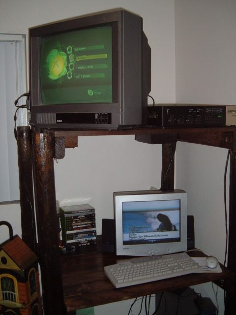 2006 Ford E350 - A CRT television displays the Xbox dashboard menu, situated on a wooden desk with computer equipment.