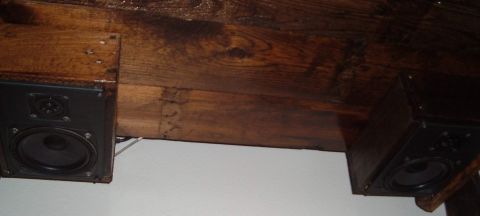 2006 Ford E350 - Two speakers are attached to the underside of a wooden structure.