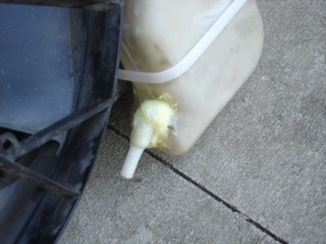 This shows the lower mounting of the mustang reservior.  This also shows how the reservior was changed and epoxied back together to allow it to fit.  I will have an aftermarket pump wired up a line run to here.  It is suprisingly sturdy.