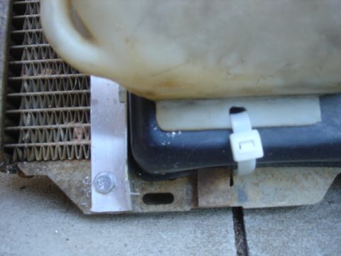 1996 Ford Bronco - The lower mounting on the towncar reservior.