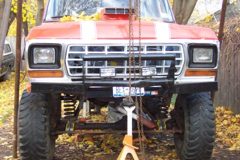 1978 Ford Bronco - This lifted 1978 Ford Bronco features a custom grille, winch, and large off-road tires, suggesting it's ready for terrain.