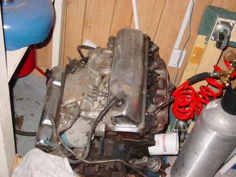 1979 Ford Bronco - A Ford V8 engine, likely from a Bronco parts section, is shown with chrome valve covers and a Motorcraft oil filter.