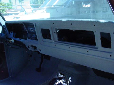 1979 Ford Bronco - Interior view of a gray dashboard with empty instrument panel and vents, likely undergoing restoration.