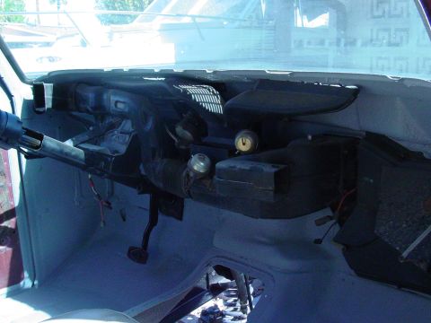 1979 Ford Bronco - The interior of a 1979 Ford Bronco shows the dashboard, steering column, and pedals.