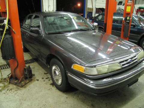 1991 Ford LTD Crown Victoria - This 1991 Ford Crown Victoria LTD is shown on a car lift in a service bay.