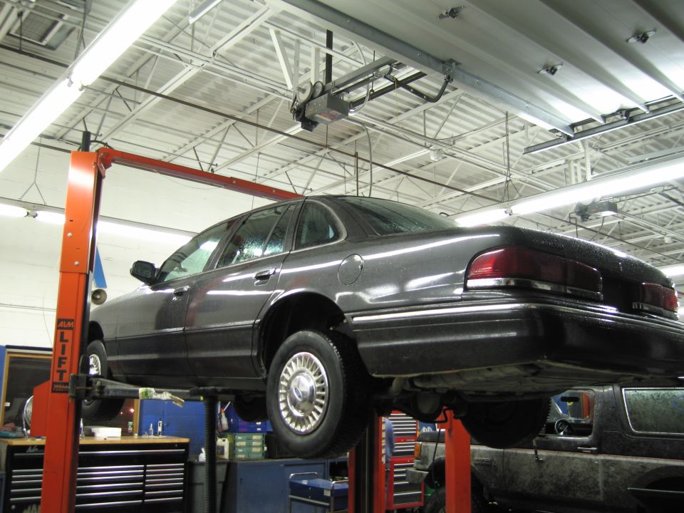 1991 Ford Crown Victoria LTD on a car lift, rear 3/4 view