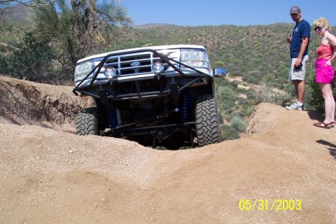 1993 Ford Bronco - A modified 1993 Ford Bronco navigates a challenging off-road course.