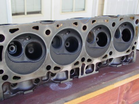 1979 Ford Bronco - Close-up of an engine cylinder head, showing the combustion chambers and valve openings.