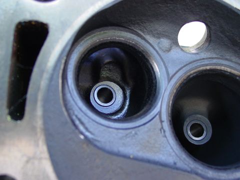 1979 Ford Bronco - Close-up view of a vehicle's cylinder head, showing two intake valves.