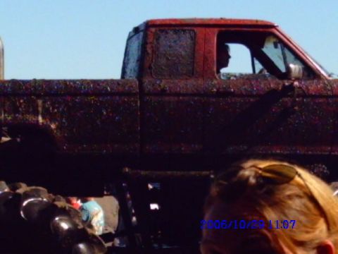 1987 Suzuki Samurai - Muddy red pickup truck side profile with a date stamp visible.