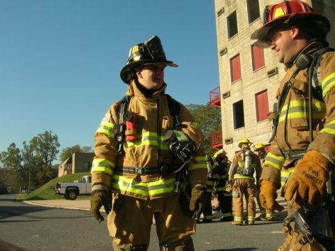 1989 Ford Bronco - Firefighters gather outside a building, likely for training exercises.